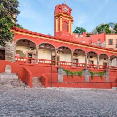 a red building with clock tower